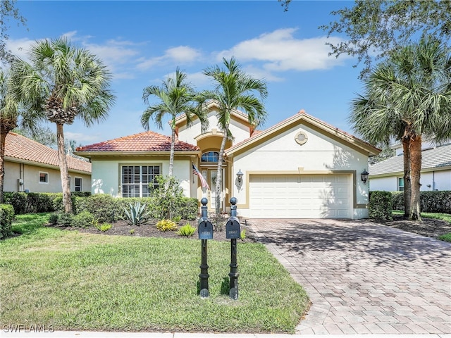 26527 Lucky Stone Rd, Bonita Springs, FL 34135 - view of front facade with stucco siding, decorative driveway, a front lawn, a garage, and a tile roof