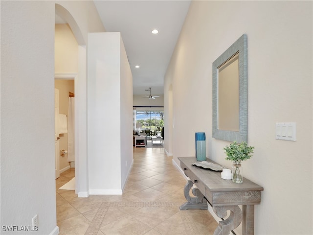 26527 Lucky Stone Rd, Bonita Springs, FL 34135 - hall with recessed lighting, light tile patterned floors, baseboards, and arched walkways