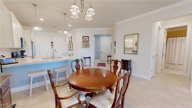 5872 Mayflower Way, Ave Maria, FL 34142 - dining room with crown molding, a chandelier, recessed lighting, baseboards, and light tile patterned floors