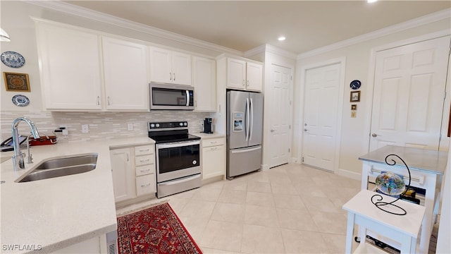 5872 Mayflower Way, Ave Maria, FL 34142 - kitchen featuring stainless steel appliances, a sink, backsplash, white cabinets, and recessed lighting