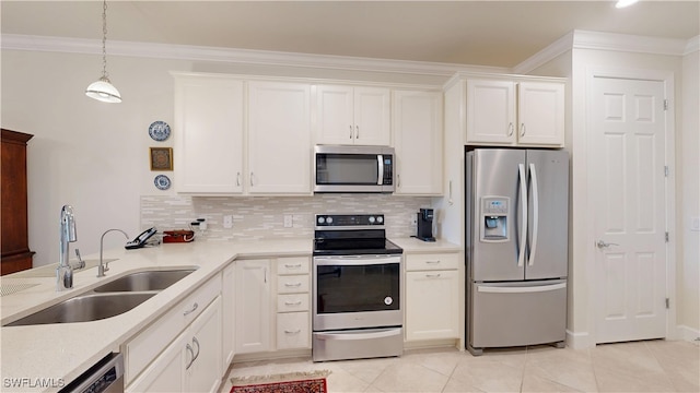 5872 Mayflower Way, Ave Maria, FL 34142 - kitchen with stainless steel appliances, a sink, decorative backsplash, light tile patterned floors, and crown molding