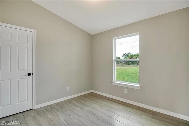 1143 Florence St E, Lehigh Acres, FL 33974 - unfurnished room featuring light wood-style flooring and baseboards