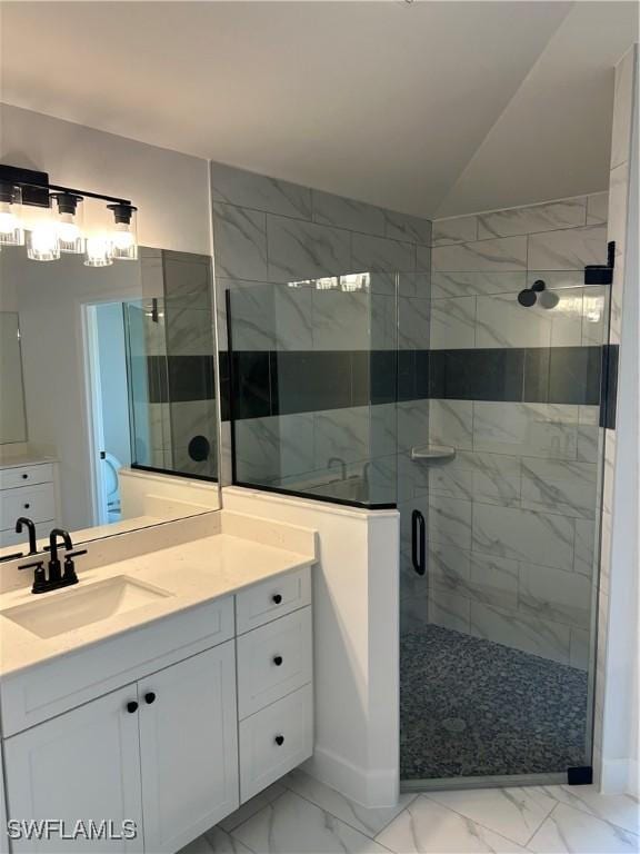 336 Ranchito Ave, Lehigh Acres, FL 33974 - bathroom featuring a shower stall, marble finish floors, vanity, and lofted ceiling