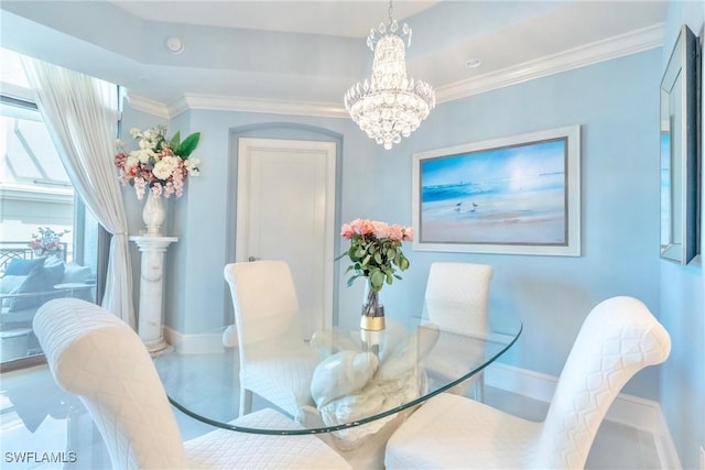 9115 Strada Pl Unit 5317, Naples, FL 34108 - dining area with a chandelier, baseboards, and ornamental molding