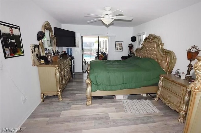 215 SE 1st Pl, Cape Coral, FL 33990 - bedroom with access to exterior, wood finished floors, and ceiling fan