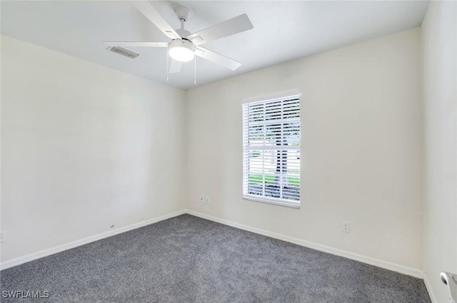 1717 43rd St SW, Naples, FL 34116 - empty room with dark colored carpet, baseboards, and a ceiling fan
