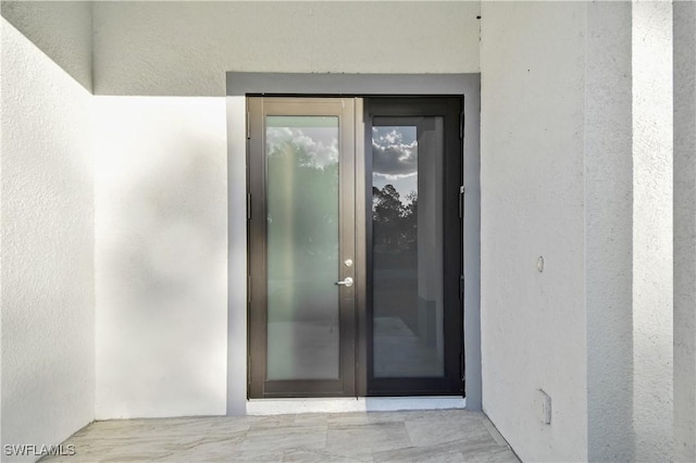 618 Sheldon Ave, Lehigh Acres, FL 33936 - view of exterior entry with stucco siding
