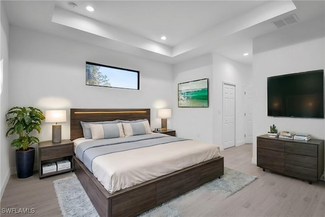 618 Sheldon Ave, Lehigh Acres, FL 33936 - bedroom with light wood-style floors, a raised ceiling, recessed lighting, and baseboards