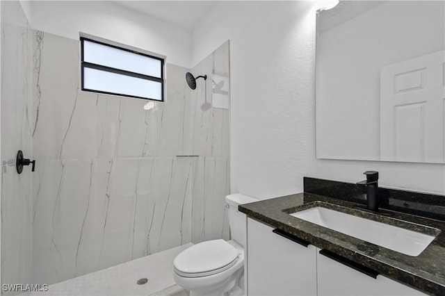 618 Sheldon Ave, Lehigh Acres, FL 33936 - full bath featuring vanity, toilet, and a marble finish shower