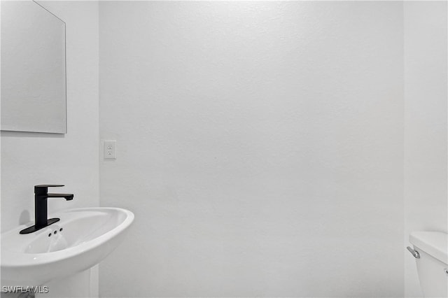 618 Sheldon Ave, Lehigh Acres, FL 33936 - bathroom featuring a sink and toilet