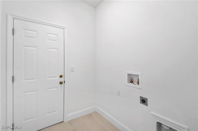 618 Sheldon Ave, Lehigh Acres, FL 33936 - laundry area featuring hookup for an electric dryer, hookup for a washing machine, baseboards, and light wood-style floors