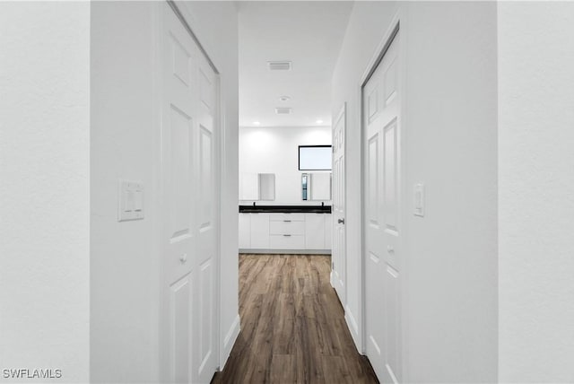 902 Magnolia Ave, Lehigh Acres, FL 33972 - corridor with dark wood-style flooring and recessed lighting