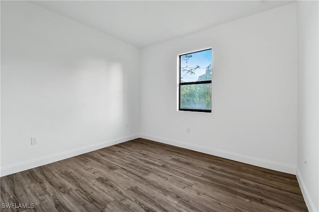 902 Magnolia Ave, Lehigh Acres, FL 33972 - spare room with wood finished floors and baseboards
