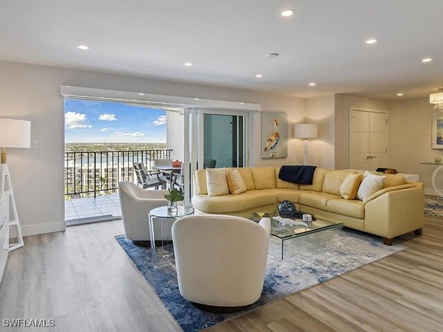 3951 Gulf Shore Blvd N Unit 1005, Naples, FL 34103 - living room with wood finished floors, recessed lighting, and baseboards