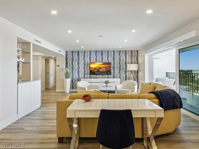 3951 Gulf Shore Blvd N Unit 1005, Naples, FL 34103 - living area with an accent wall, light wood-style floors, recessed lighting, and baseboards