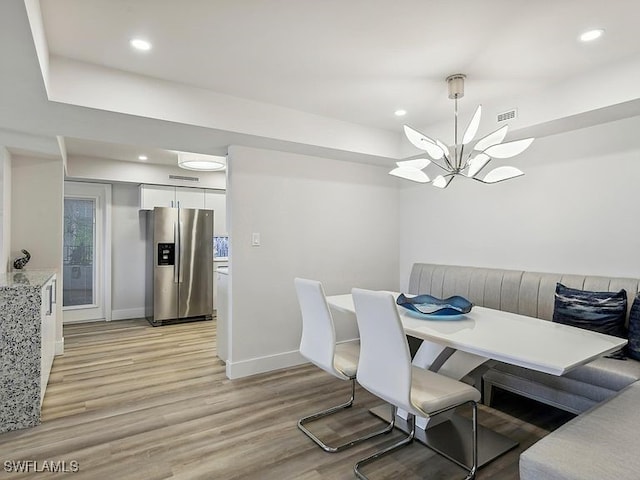 3951 Gulf Shore Blvd N Unit 1005, Naples, FL 34103 - dining area featuring light wood-style flooring, a chandelier, recessed lighting, and baseboards