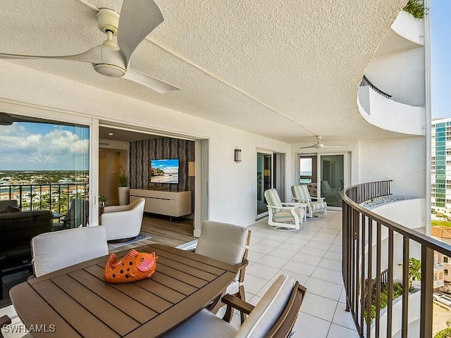 3951 Gulf Shore Blvd N Unit 1005, Naples, FL 34103 - view of patio featuring ceiling fan, outdoor dining area, and a balcony