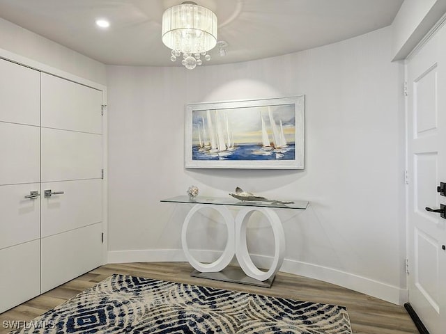 3951 Gulf Shore Blvd N Unit 1005, Naples, FL 34103 - entrance foyer with baseboards, light wood-style floors, a chandelier, and recessed lighting