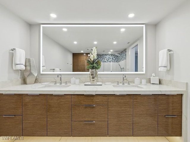 3951 Gulf Shore Blvd N Unit 1005, Naples, FL 34103 - full bath with double vanity, a walk in shower, and recessed lighting