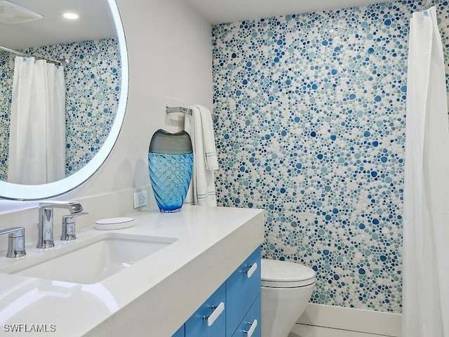 3951 Gulf Shore Blvd N Unit 1005, Naples, FL 34103 - bathroom featuring vanity, toilet, curtained shower, and tile patterned flooring