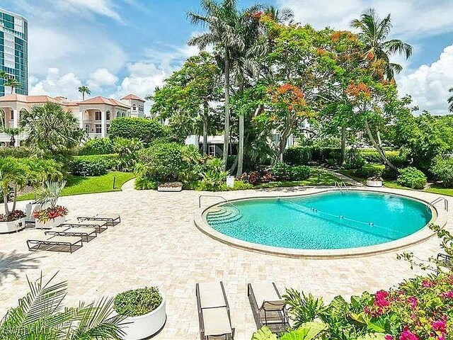 3951 Gulf Shore Blvd N Unit 1005, Naples, FL 34103 - community pool with a patio area