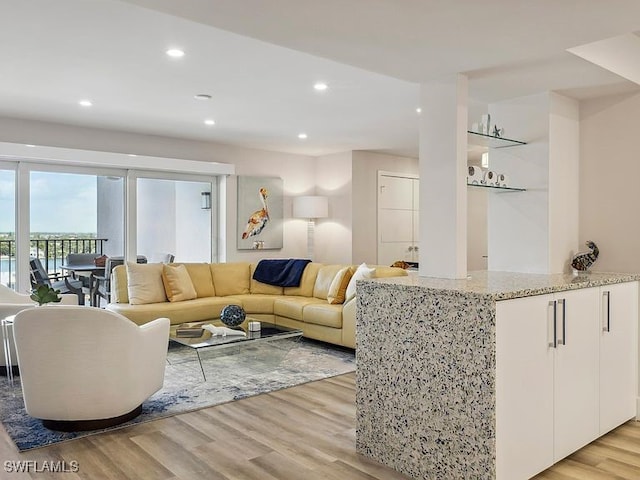 3951 Gulf Shore Blvd N Unit 1005, Naples, FL 34103 - living room with light wood-type flooring and recessed lighting