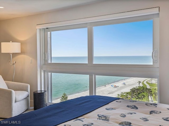 3951 Gulf Shore Blvd N Unit 1005, Naples, FL 34103 - bedroom featuring a water view and multiple windows