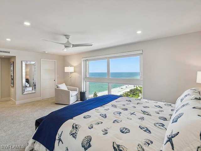 3951 Gulf Shore Blvd N Unit 1005, Naples, FL 34103 - carpeted bedroom featuring a water view, recessed lighting, a ceiling fan, and baseboards