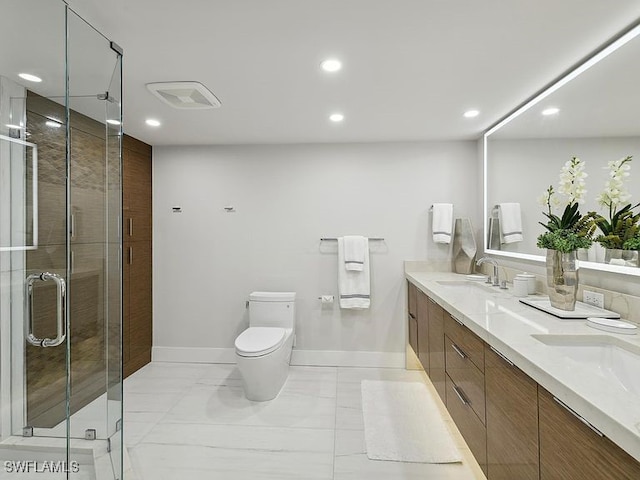 3951 Gulf Shore Blvd N Unit 1005, Naples, FL 34103 - bathroom featuring double vanity, recessed lighting, toilet, a shower stall, and baseboards