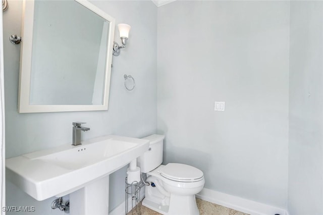 491 Wedge Dr, Naples, FL 34103 - bathroom with toilet and baseboards