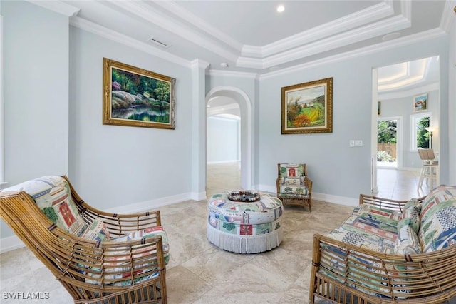 491 Wedge Dr, Naples, FL 34103 - living area with ornamental molding, arched walkways, a raised ceiling, and recessed lighting