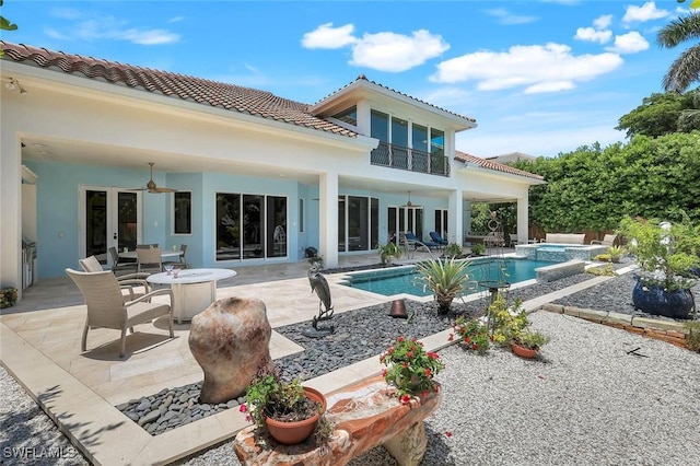 491 Wedge Dr, Naples, FL 34103 - rear view of house with ceiling fan, a tiled roof, a patio area, and stucco siding