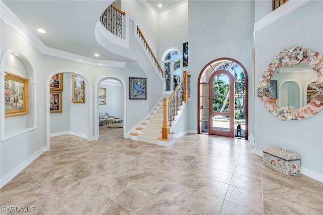 491 Wedge Dr, Naples, FL 34103 - entrance foyer featuring stairs, recessed lighting, crown molding, a towering ceiling, and arched walkways