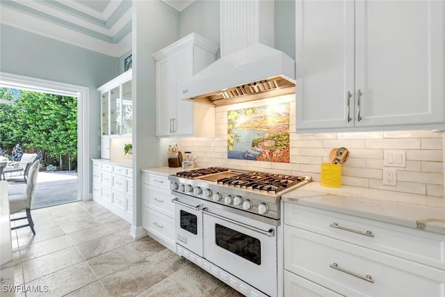 491 Wedge Dr, Naples, FL 34103 - kitchen featuring custom range hood, double oven range, white cabinetry, tasteful backsplash, and light stone countertops