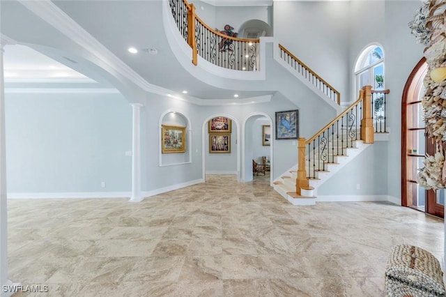 491 Wedge Dr, Naples, FL 34103 - entryway featuring arched walkways, recessed lighting, stairway, marble finish flooring, and a towering ceiling