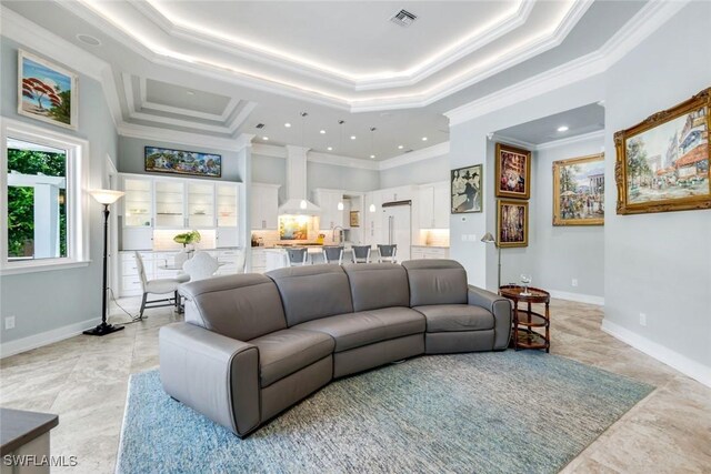 491 Wedge Dr, Naples, FL 34103 - living area with crown molding, recessed lighting, and a tray ceiling