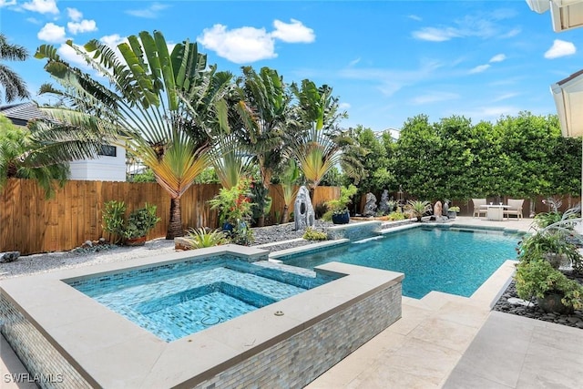 491 Wedge Dr, Naples, FL 34103 - view of swimming pool featuring a fenced backyard, a patio, and a pool with connected hot tub