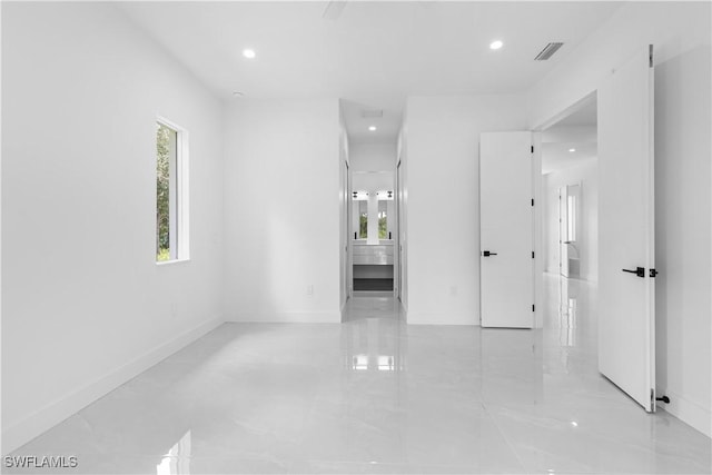 3762 32nd Ave SE, Naples, FL 34117 - hall with healthy amount of natural light, baseboards, and recessed lighting