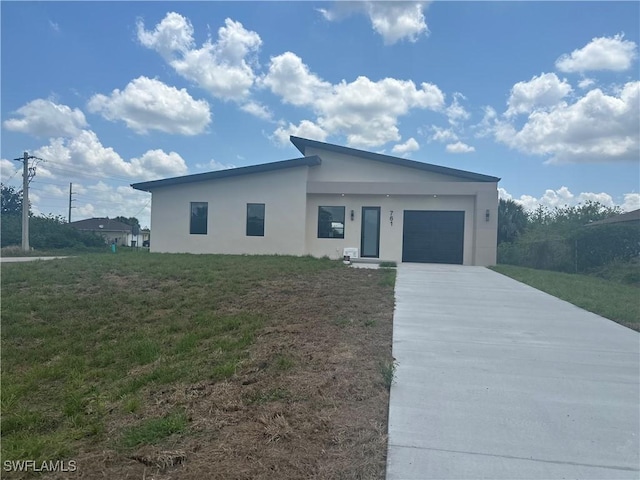 761 Bell Blvd S, Lehigh Acres, FL 33974 - contemporary home featuring driveway, stucco siding, a garage, and a front lawn
