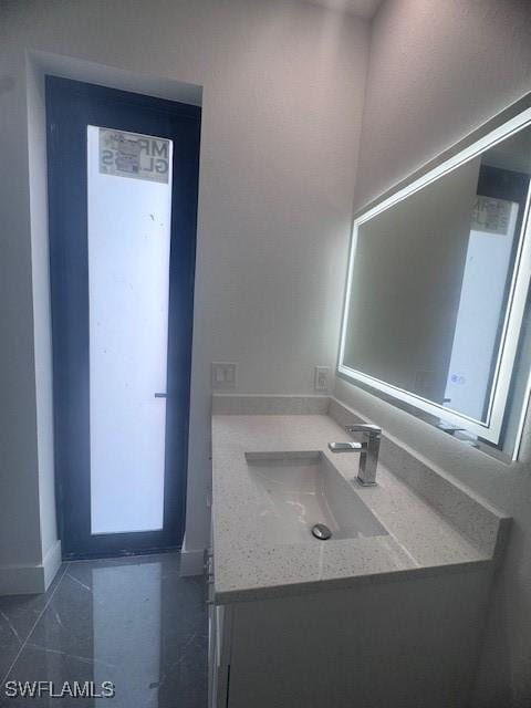 31 Kismet Pkwy E, Cape Coral, FL 33909 - bathroom with vanity and baseboards