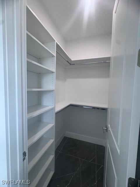 31 Kismet Pkwy E, Cape Coral, FL 33909 - walk in closet with dark tile patterned flooring