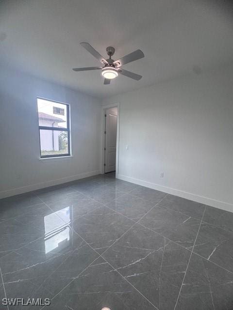 31 Kismet Pkwy E, Cape Coral, FL 33909 - spare room featuring baseboards and a ceiling fan