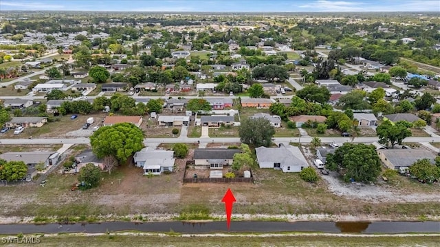 416 Rushmore Ave S, Lehigh Acres, FL 33936 - aerial view of property and surrounding area featuring nearby suburban area