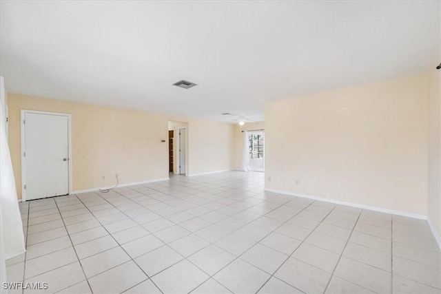 416 Rushmore Ave S, Lehigh Acres, FL 33936 - spare room featuring baseboards and light tile patterned floors