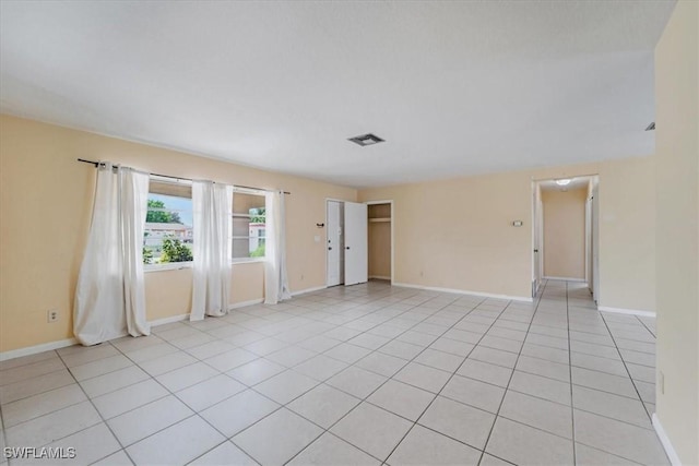 416 Rushmore Ave S, Lehigh Acres, FL 33936 - empty room featuring baseboards and light tile patterned floors