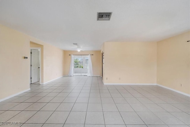 416 Rushmore Ave S, Lehigh Acres, FL 33936 - empty room featuring ceiling fan, light tile patterned flooring, and baseboards