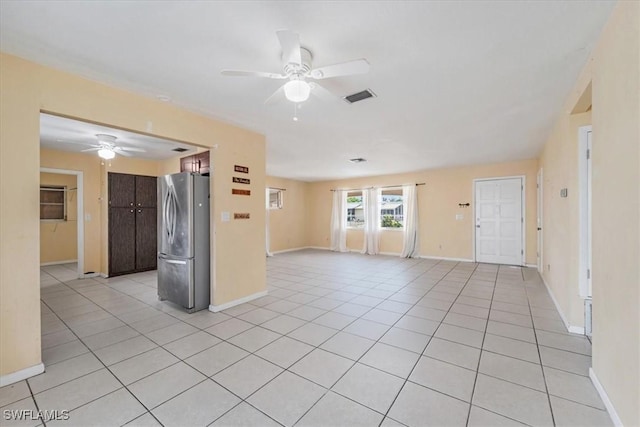 416 Rushmore Ave S, Lehigh Acres, FL 33936 - empty room with ceiling fan, light tile patterned floors, and baseboards