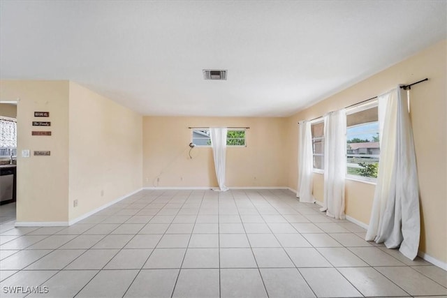 416 Rushmore Ave S, Lehigh Acres, FL 33936 - empty room with baseboards and light tile patterned floors