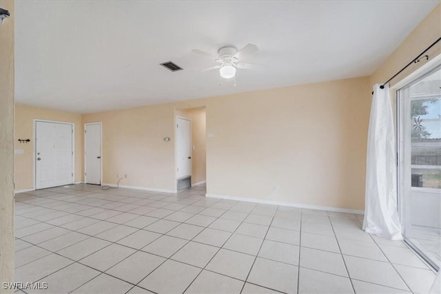 416 Rushmore Ave S, Lehigh Acres, FL 33936 - spare room featuring ceiling fan, baseboards, and light tile patterned floors