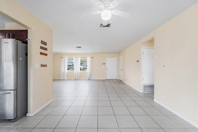 416 Rushmore Ave S, Lehigh Acres, FL 33936 - unfurnished living room featuring ceiling fan, baseboards, and light tile patterned flooring
